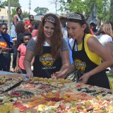 Kings County's dairy princesses took their turn building a slice.